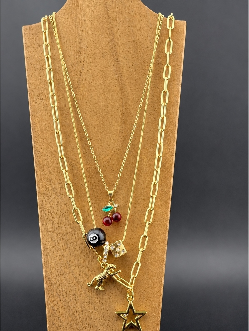 Set of 3 Gold Tone Charm Necklaces with Star, Dinosaur, Dice